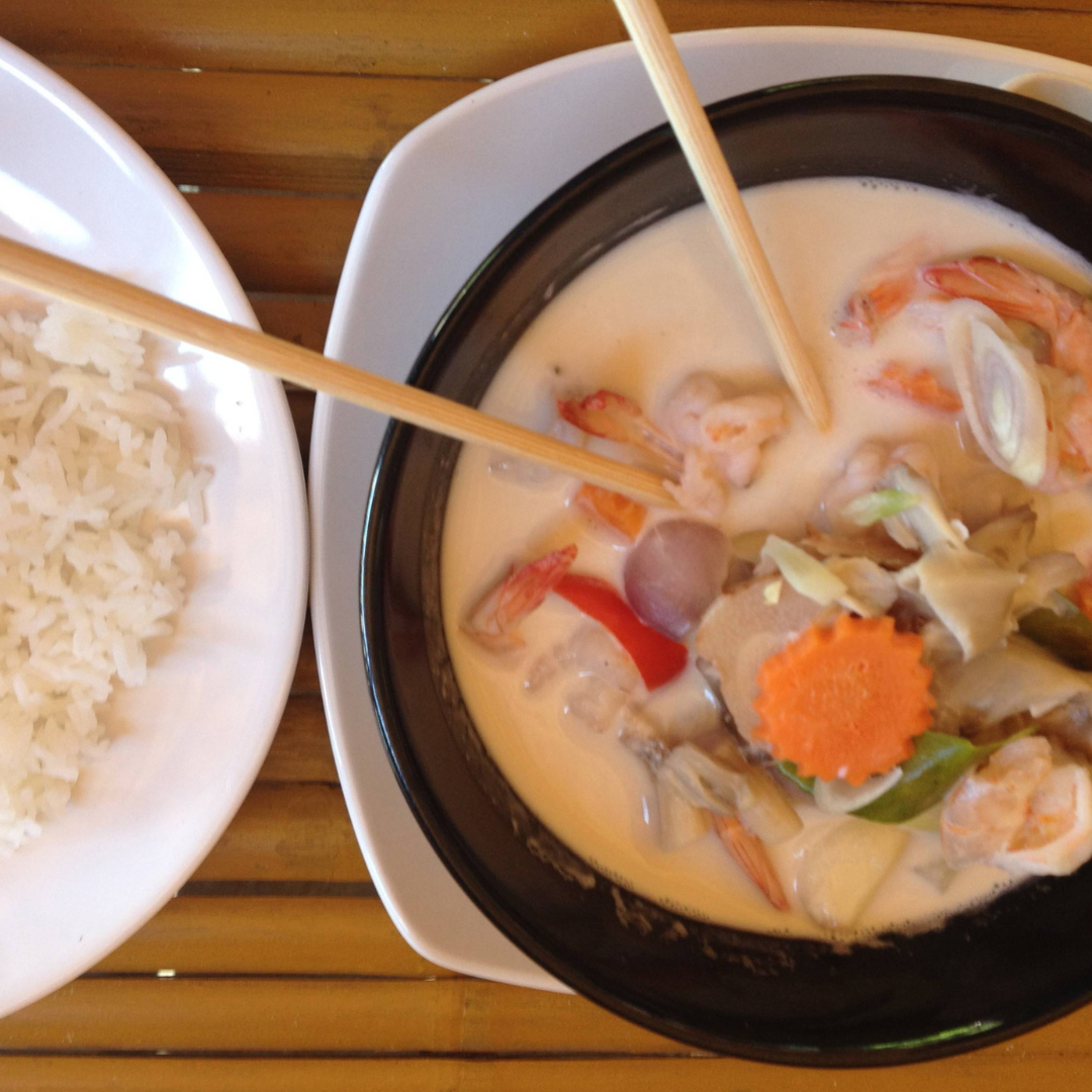 tom yum soup and a rice bowl