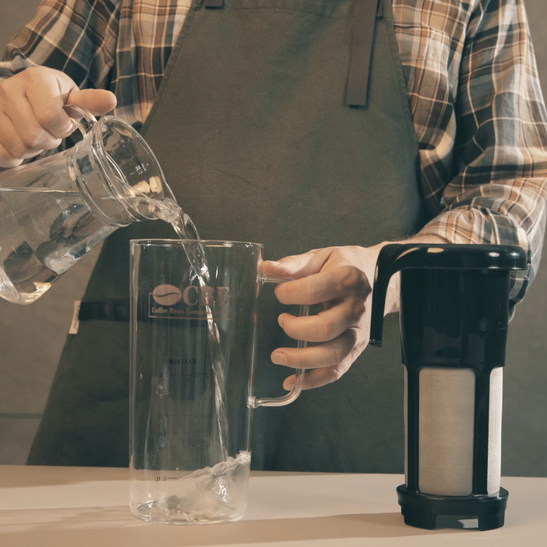 a coffee lover preparing a cold brew coffee with cbe filter